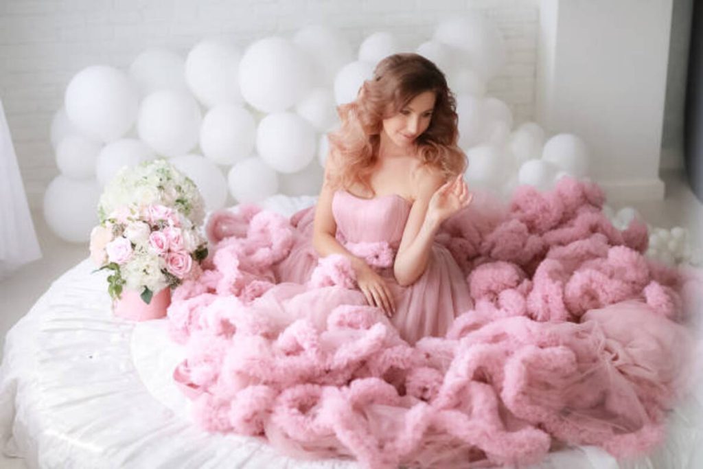Show Off Your Feminine Side With This Pink Feather Dress